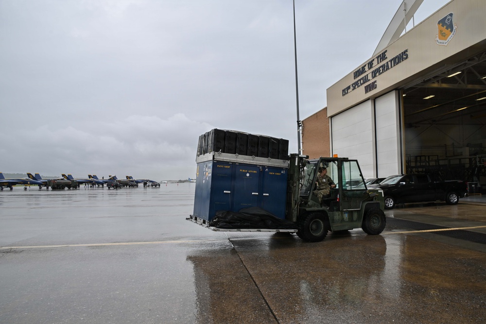 Pennsylvania Air National Guard member moves Blue Angels cargo with a forklift