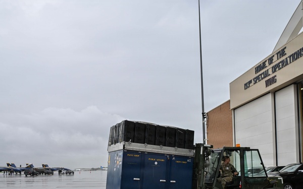 Pennsylvania Air National Guard member moves Blue Angels cargo with a forklift