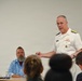 Rear Adm. Eric Ver Hage speaks to audience at Harrisburg University
