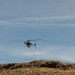 Military unmanned aerial vehicle conducts flight operations over arid terrain