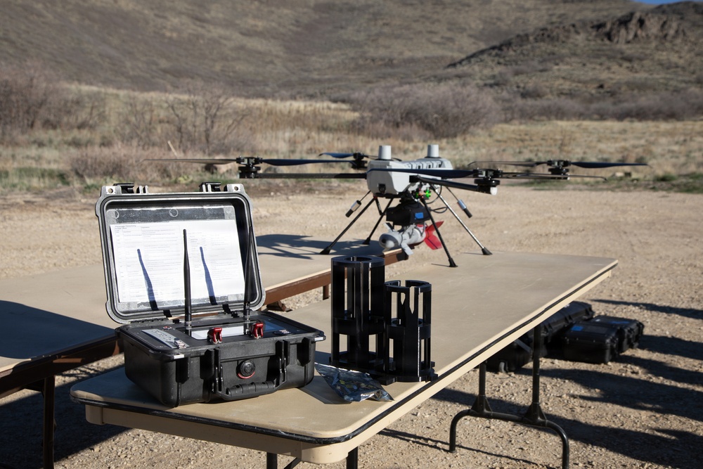 Military UAS Ground Control Station and Multi-Rotor Drone Staged at Desert Training Site