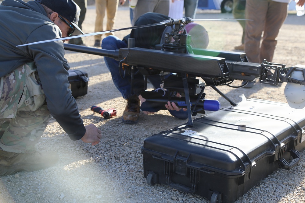 Military Personnel Assemble Unmanned Aircraft System During Field Exercise