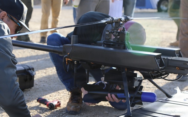Military Personnel Assemble Unmanned Aircraft System During Field Exercise