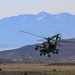 U.S. Army AH-64 Apache Attack Helicopter Conducts Low-Level Flight Operations Over Mountain Terrain