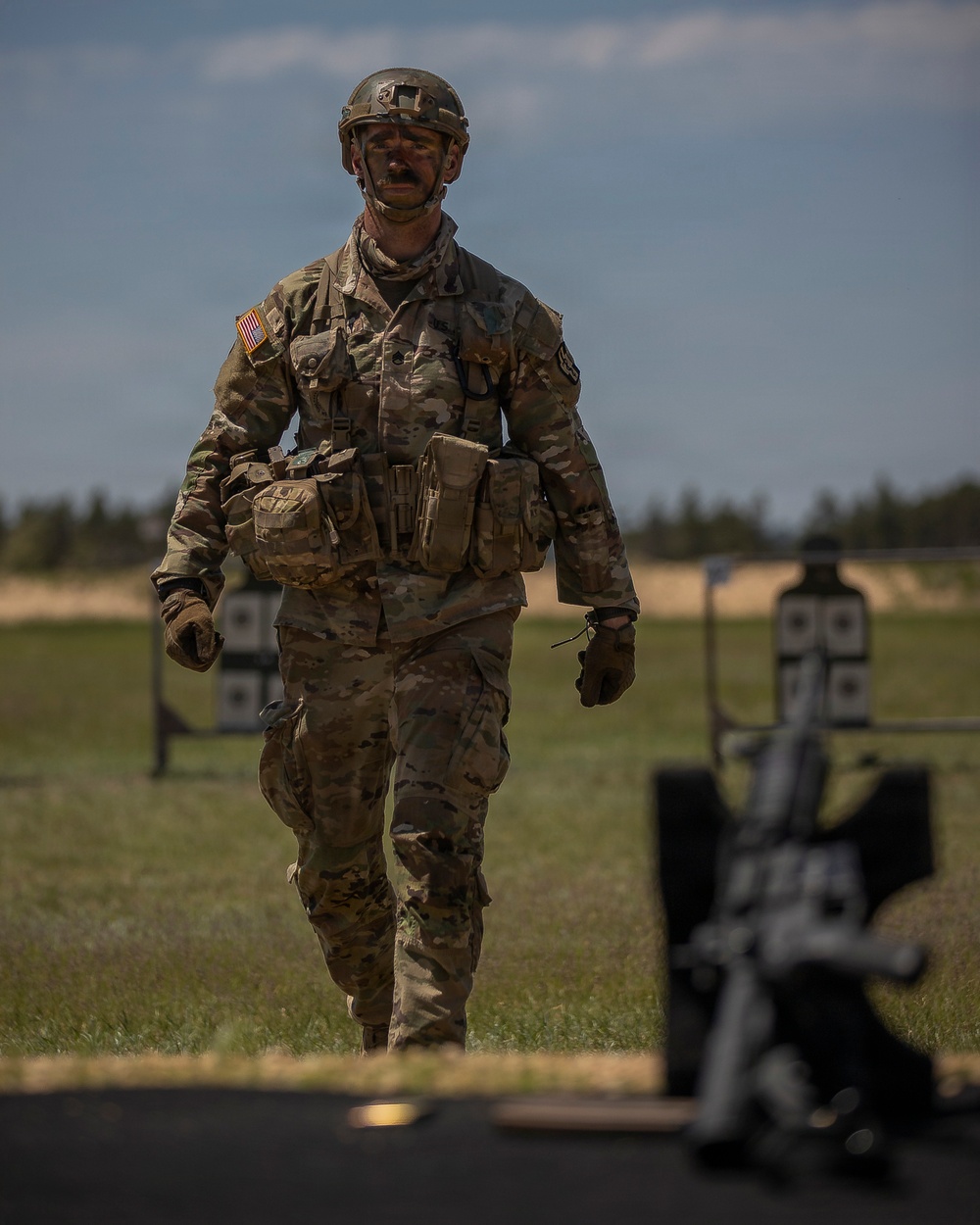 U.S. Army Soldier Prepares to Engage in a Live Fire Range Exercise during the Best Squad Competition