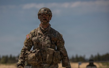 U.S. Army Soldier Prepares to Engage in a Live Fire Range Exercise during the Best Squad Competition