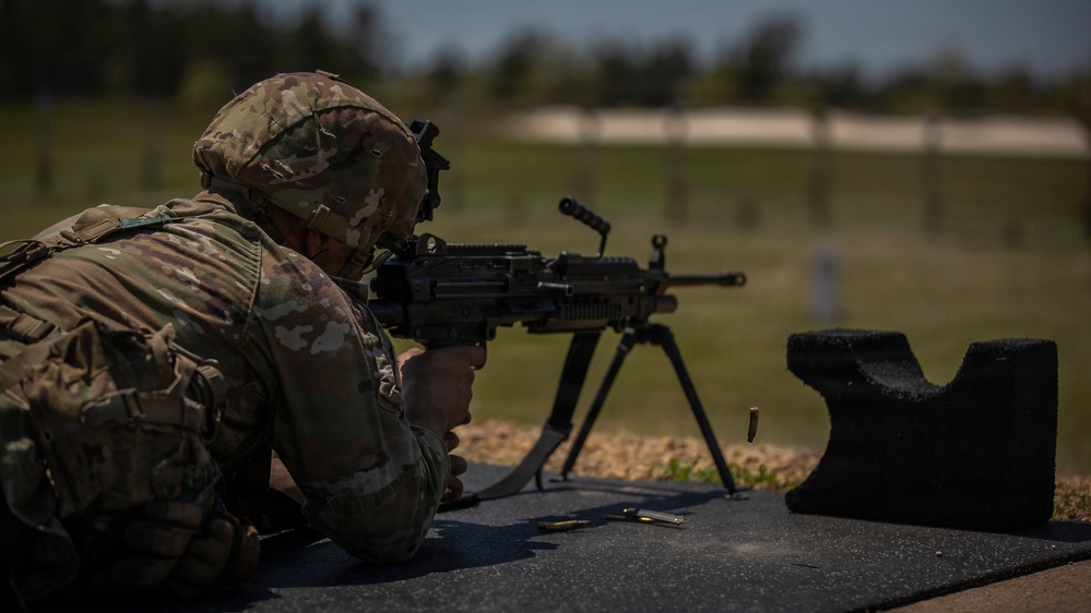 U.S. Army Soldier Engages in a Live Fire Range Exercise during the Best Squad Competition