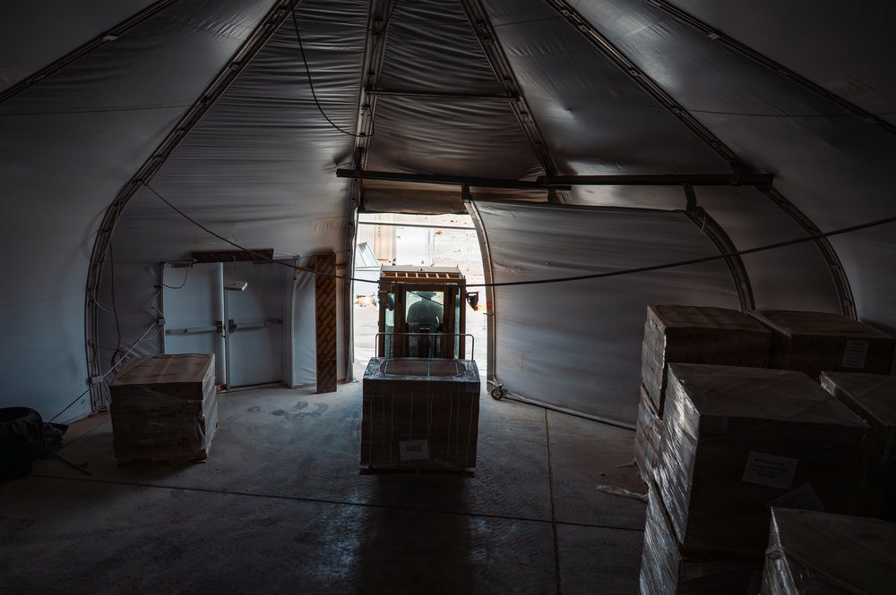 FSS Airmen unload MREs
