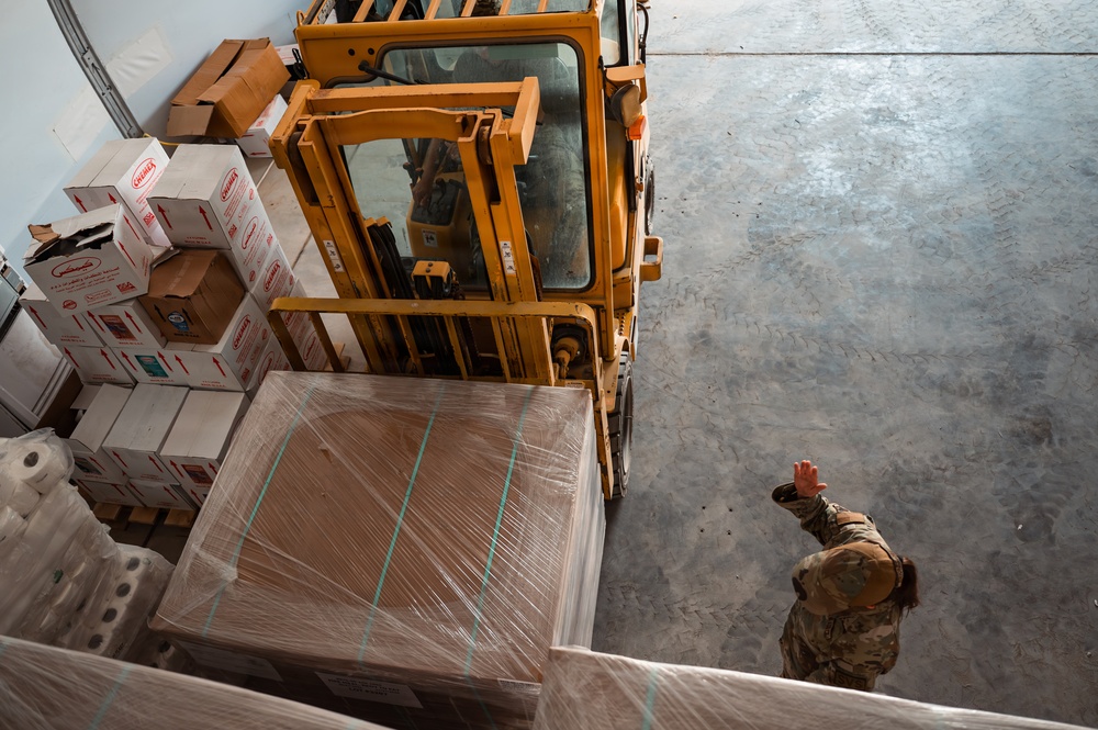 FSS Airmen unload MREs