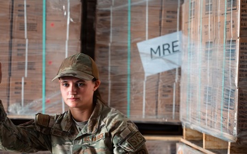 FSS Airmen unload MREs
