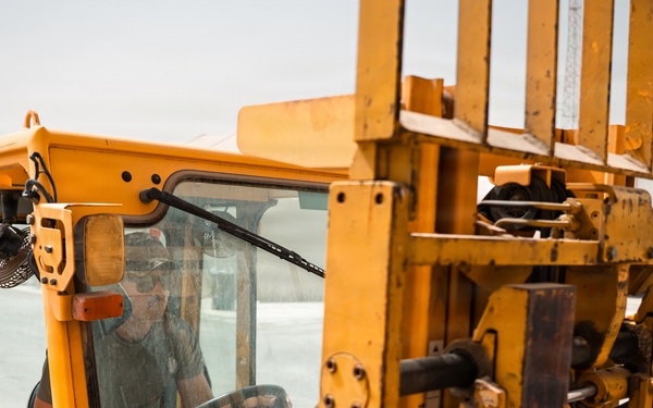 FSS Airmen unload MREs