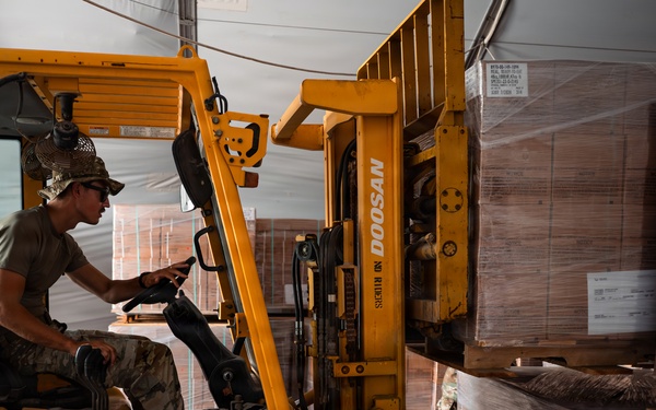 FSS Airmen unload MREs