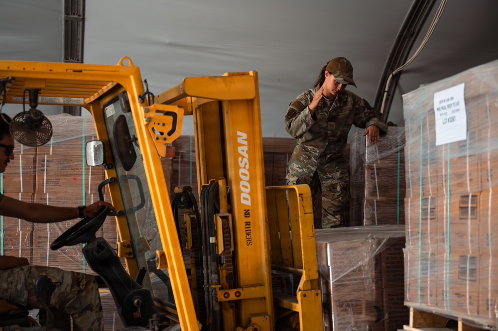 FSS Airmen unload MREs