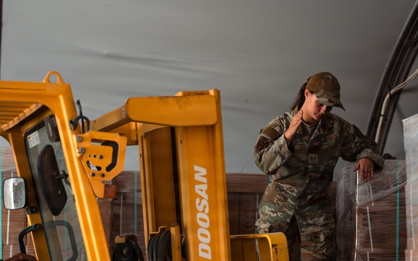 FSS Airmen unload MREs