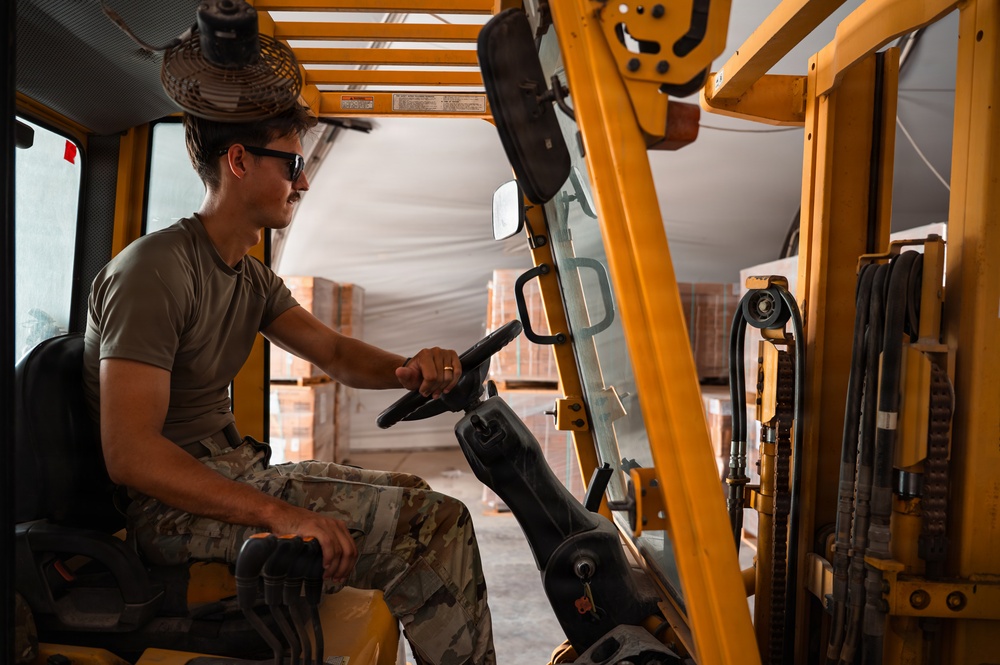 FSS Airmen unload MREs