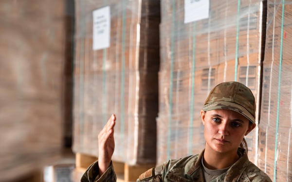 FSS Airmen unload MREs
