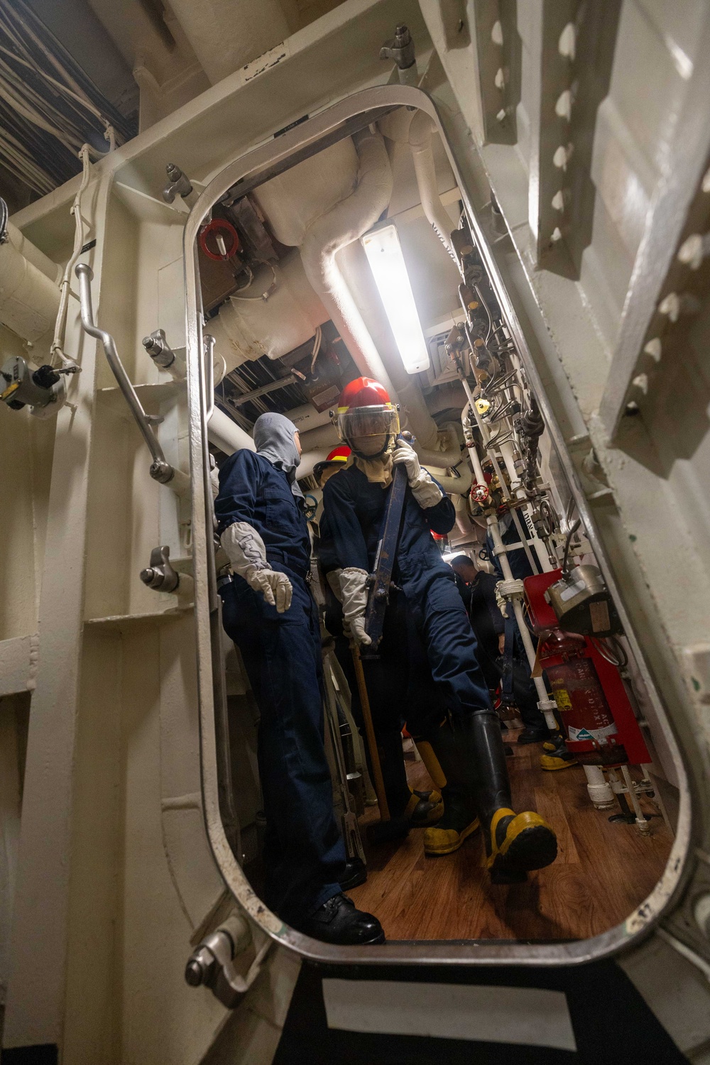 USS Mustin conducts an evening general quarters drill