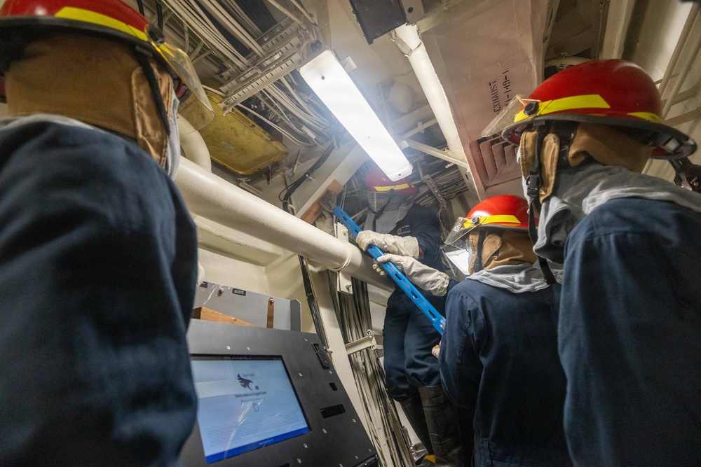 USS Mustin conducts an evening general quarters drill