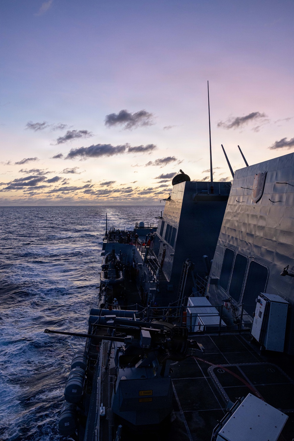 USS Mustin conducts a replenishment-at-sea with USNS Arctic