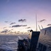 USS Mustin conducts a replenishment-at-sea with USNS Arctic