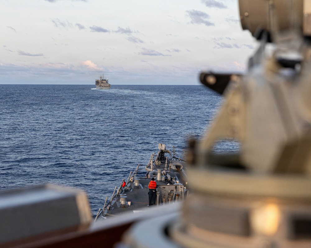 USS Mustin conducts a replenishment-at-sea with USNS Arctic