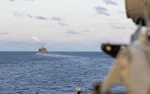 USS Mustin conducts a replenishment-at-sea with USNS Arctic