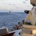 USS Mustin conducts a replenishment-at-sea with USNS Arctic