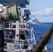 USS Mustin conducts a replenishment-at-sea with USNS Arctic