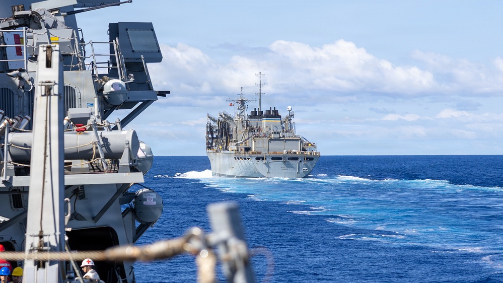 USS Mustin conducts a replenishment-at-sea with USNS Arctic