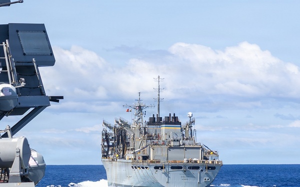 USS Mustin conducts a replenishment-at-sea with USNS Arctic