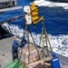 USS Mustin conducts a replenishment-at-sea with USNS Arctic