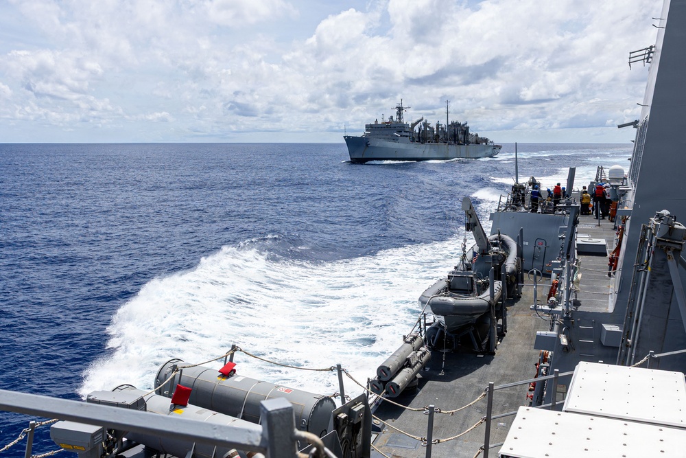 USS Mustin conducts a replenishment-at-sea with USNS Arctic