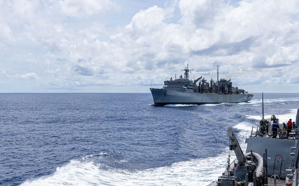 USS Mustin conducts a replenishment-at-sea with USNS Arctic