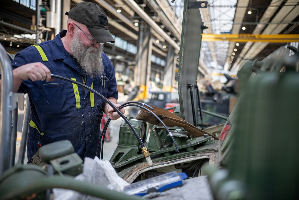 TLSC-EA mechanic repairs a M1126 Stryker Infantry Carrier Vehicle