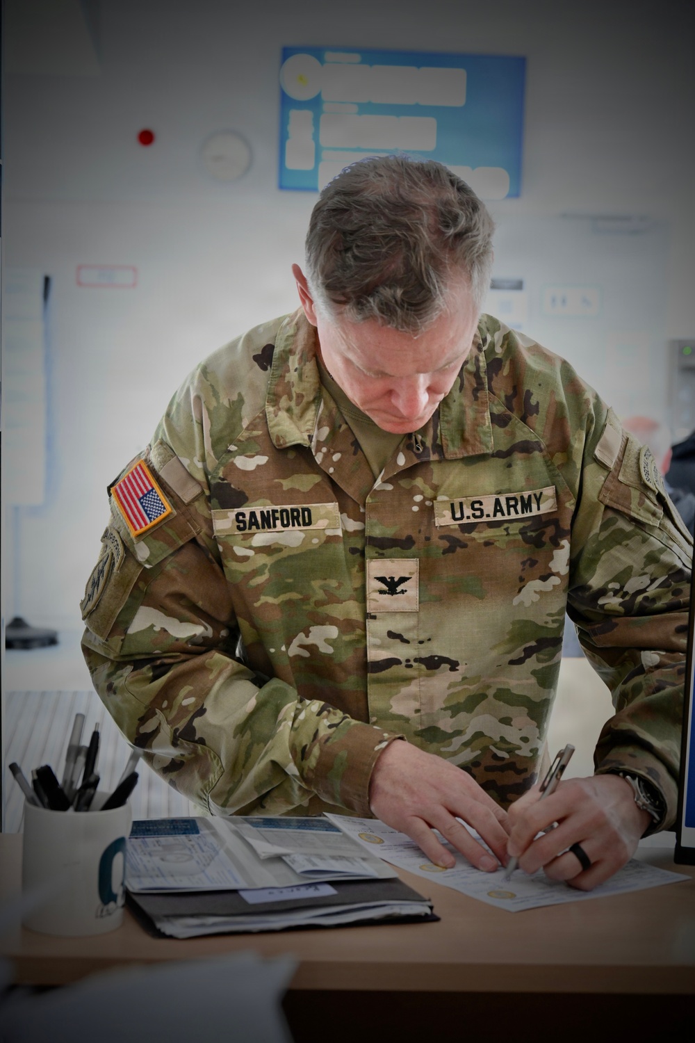 USAG Stuttgart Commander Col. Edward J. Sanford re-registers his vehicle on May 20, 2026