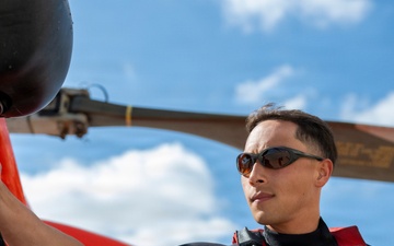 Coast Guard rescue swimmer hangs gear to dry following flight operations in San Antonio