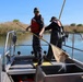 Crew member emptying net into live well