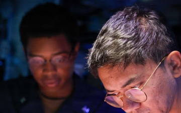 USS John Finn Sailors Stand Watch in the Combat Information Center