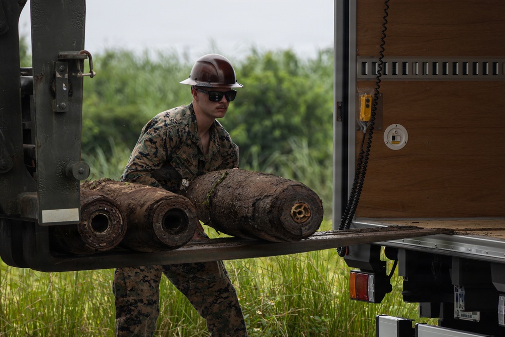 EOD Marines conduct an explosive disposal operation at Ie Shima