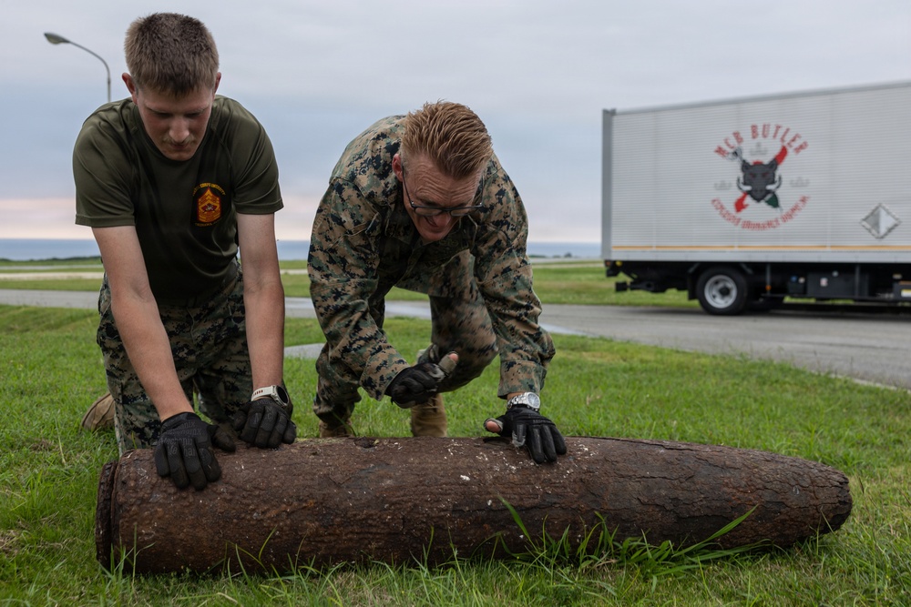 EOD Marines conduct an explosive disposal operation at Ie Shima