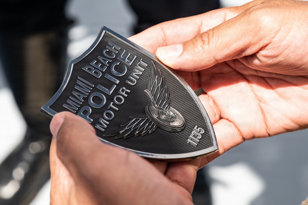 AFRC Command Chief presented with Miami Beach Motor unit Coin