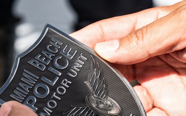 AFRC Command Chief presented with Miami Beach Motor unit Coin