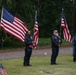 Motorcycle club members form flag line at veterans cemetery memorial service