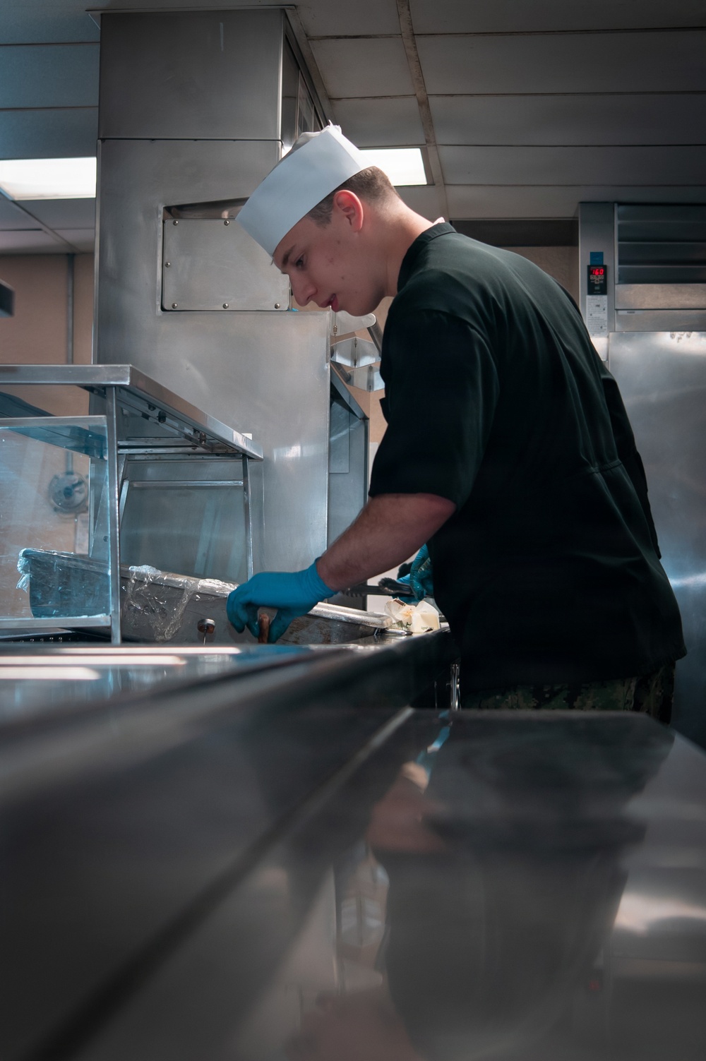 USS Ronald Reagan (CVN 76) Sailors Prepare Food in the Galley
