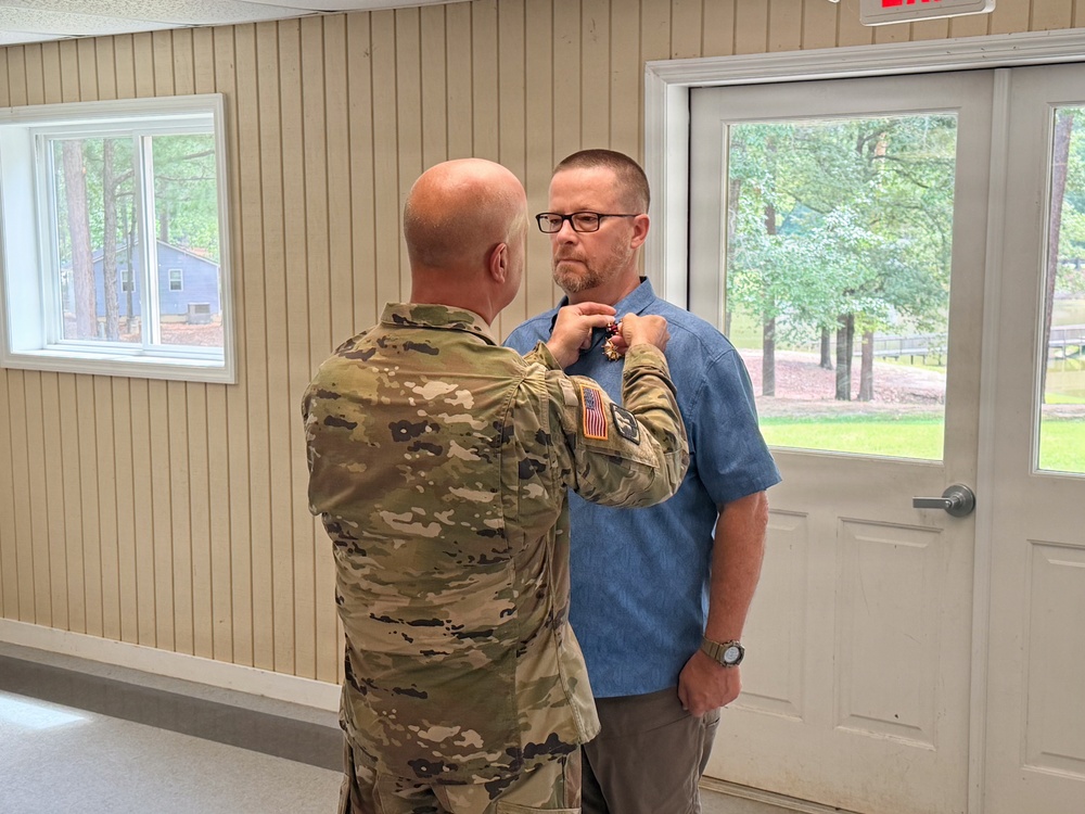 U.S. Army Chief Warrant Officer 5 (Ret.) James Robinson, South Carolina National Guard, receives the Legion of Merit.
