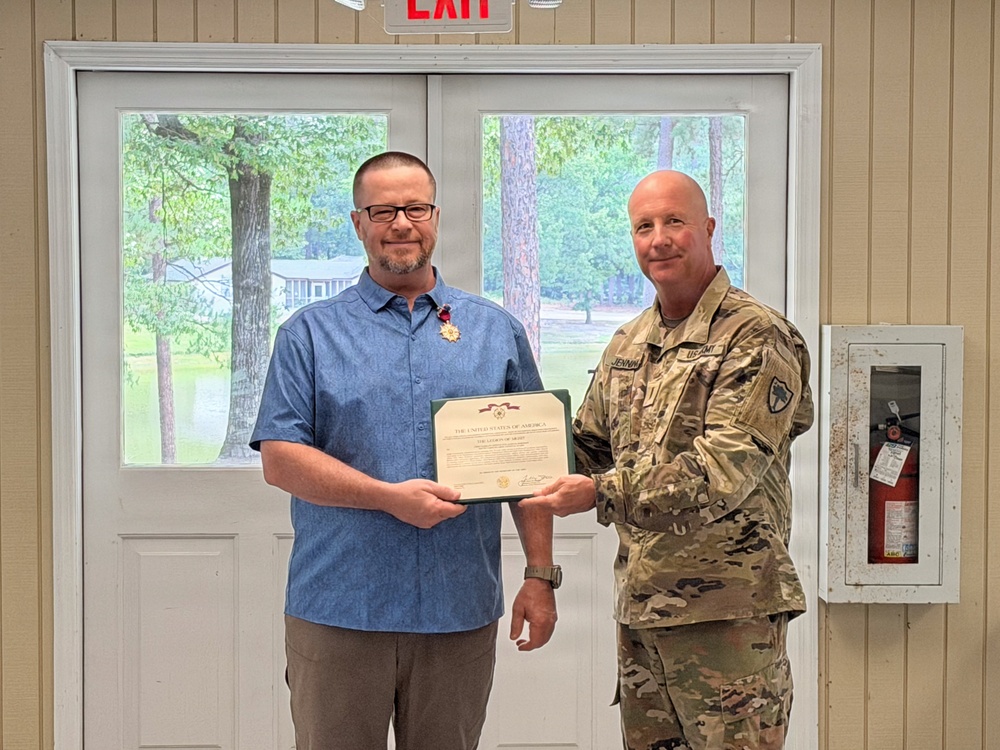 U.S. Army Chief Warrant Officer 5 (Ret.) James Robinson, South Carolina National Guard, receives the Legion of Merit.