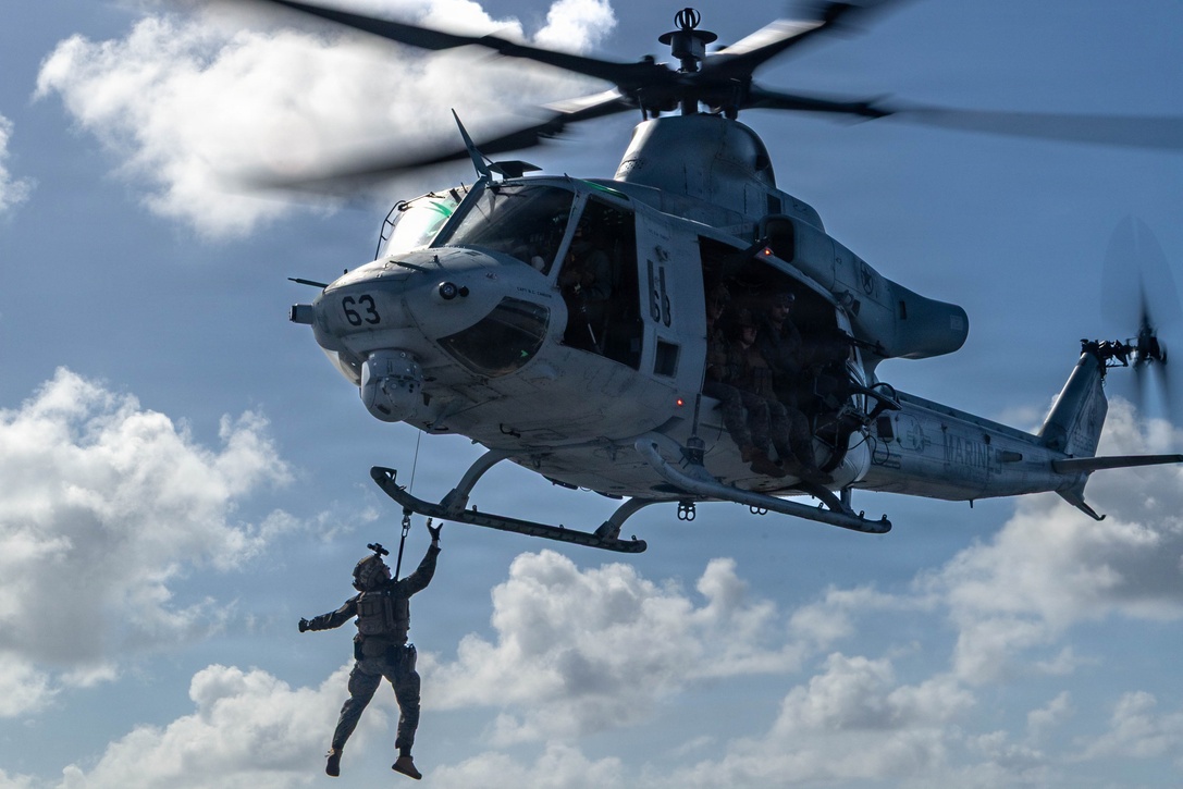 A U.S. Marine Corps UH-1Y Venom helicopter assigned to Marine Medium Tiltrotor Squadron (VMM) 365 (Reinforced), Littoral Combat Force-24, hoists a Marine with Maritime Raid Force, 24th MEU, from San Antonio-class amphibious transport dock USS Fort Lauderdale (LPD 28) during a Maritime Interdiction Operation Full Mission Profile rehearsal while underway in the Caribbean Sea, May 22, 2026. U.S. military forces are deployed to the U.S. Southern Command area of responsibility in support of Operation SOUTHERN SPEAR, Department of War-directed operations, and the president’s priorities to disrupt illicit drug trafficking, deter malign actors and protect the homeland through continuous presence. (U.S. Marine Corps photo)