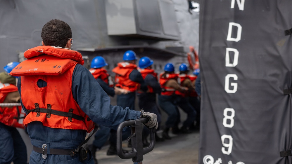 USS Mustin conducts a replenishment-at-sea with USNS Alan Shepard