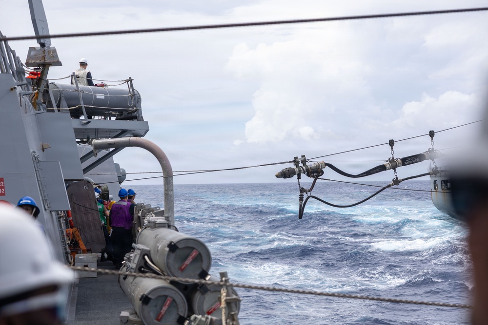 USS Mustin conducts a replenishment-at-sea with USNS Alan Shepard