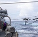 USS Mustin conducts a replenishment-at-sea with USNS Alan Shepard